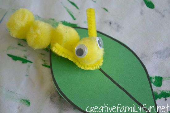 Grab some simple craft supplies to make this fun classic craft with your kids, Pom pom Caterpillar. It's so easy to make and looks so cute on it simple paper leaf.