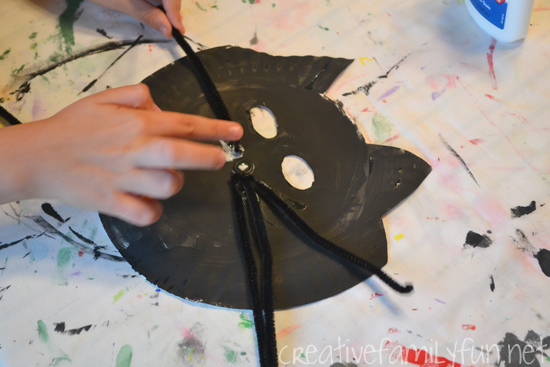 This paper plate Halloween Black Cat Mask is a little bit silly, a little bit spooky, but not a bit scary. It's fun for pretend play!