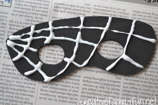 Make a simple glittery Spider Web Mask for kids out of craft foam. It's perfect for Halloween or everyday dress-up time. So much fun!