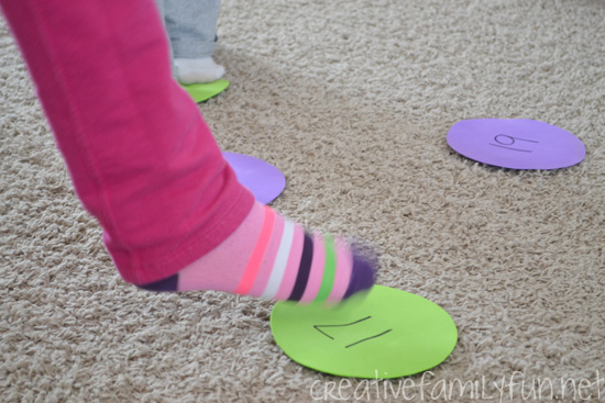 Learn and move with this fun math facts game, Math Facts Islands. This gross motor math fun is a fun way to practice and a great way to move after school.