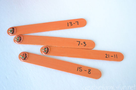 Practice math facts with this fun Halloween addition game, Pumpkin Pick-and-Solve Sticks. It's a fun way to add some holiday fun to your math practice.