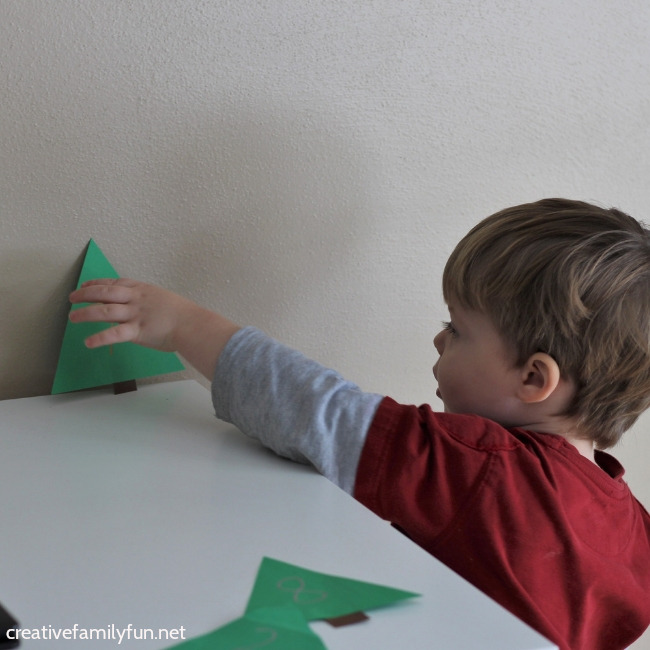 Have fun counting and learning number recognition with this fun and easy to prep Christmas tree number hunt activity for toddlers.