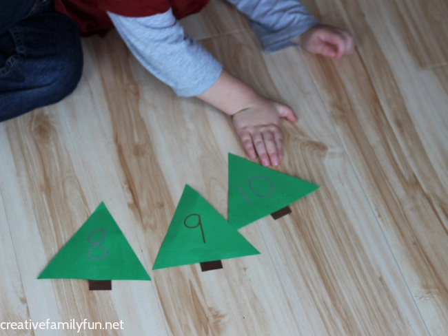 Have fun counting and learning number recognition with this fun and easy to prep Christmas tree number hunt activity for toddlers.