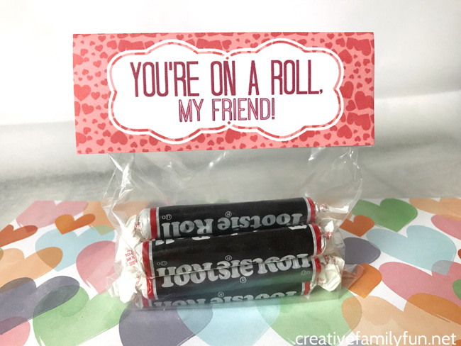 Give your friends a sweet treat with this fun, free printable Tootsie Roll Valentine Bag Topper. It's a great classroom Valentine option.