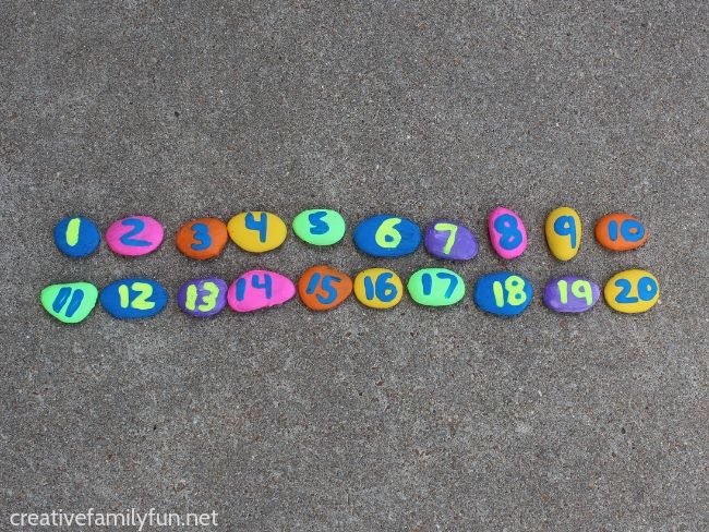 Make a fun set of rainbow number rocks to help your toddler practice counting. Includes DIY instructions and fun counting games to play.