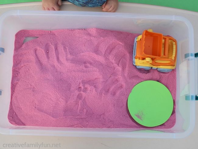 Have fun playing and learning your alphabet with this fun watermelon sensory sand activity with homemade alphabet rocks. It's a fun summer sensory activity!